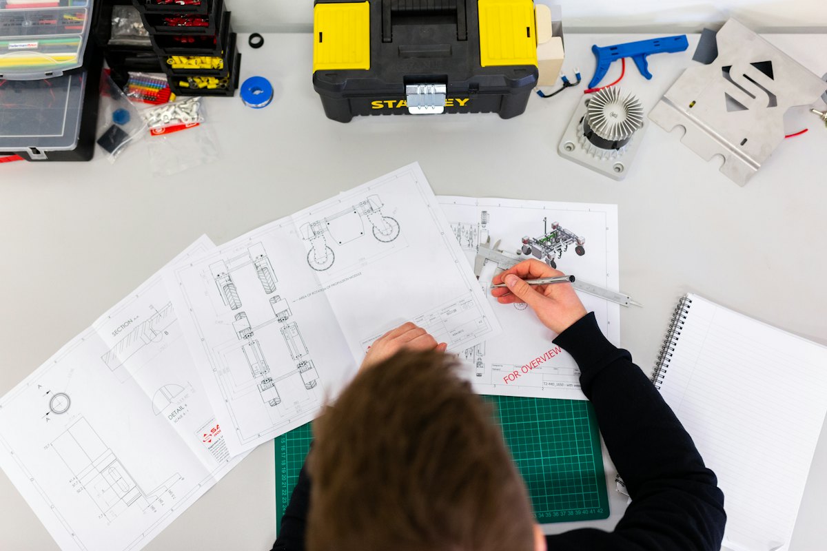 Engineer reviewing a technical drawing